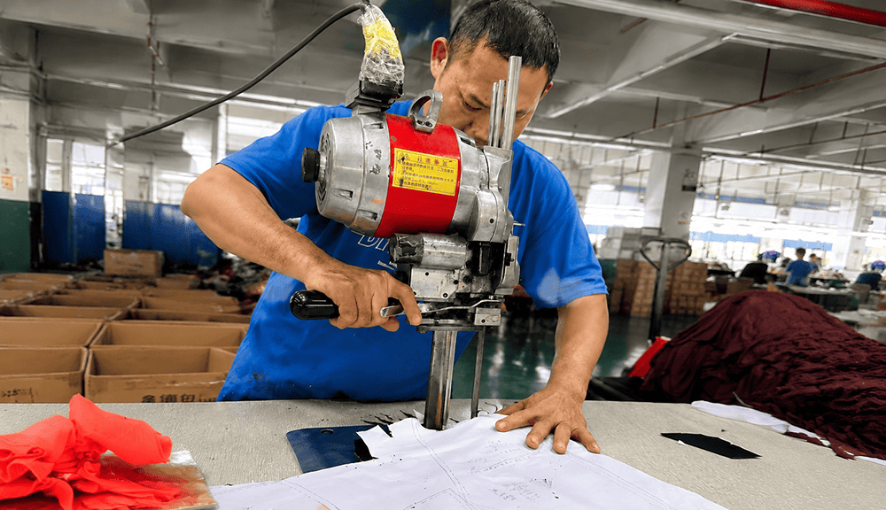 Automated fabric cutting process for custom sportswear production
